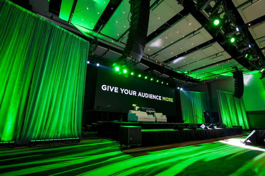 A striking stage design with green LED lighting at an Atlanta event.