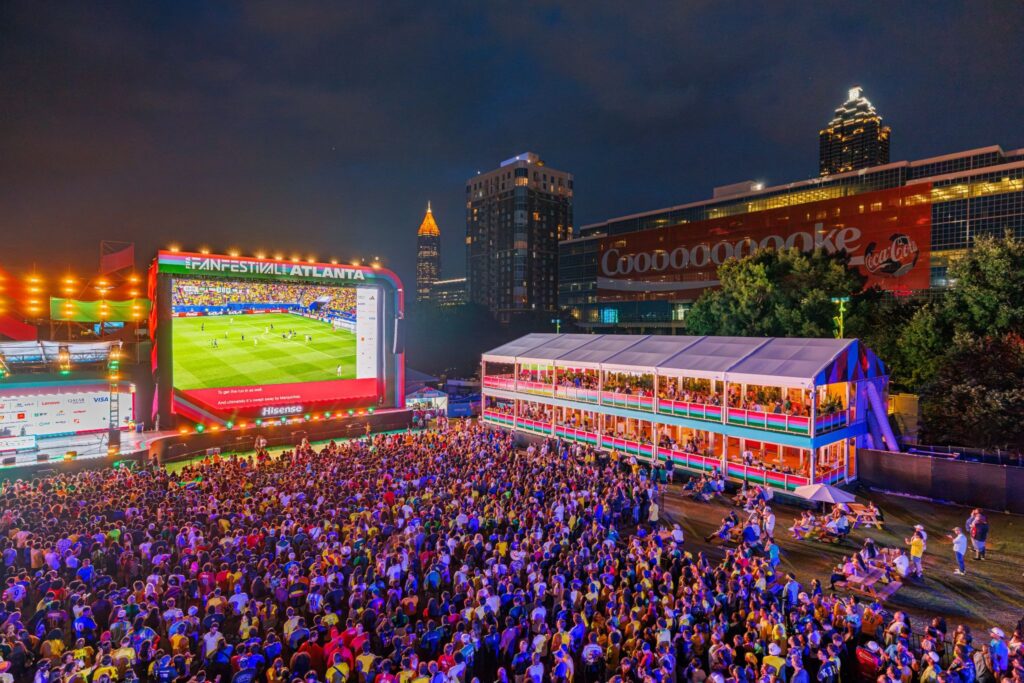 View of crowd watching game at the FIFA Fan Festival at night