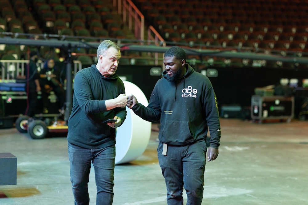 Two guys on Technical Elements' strategic site team give knuckles after a job well done